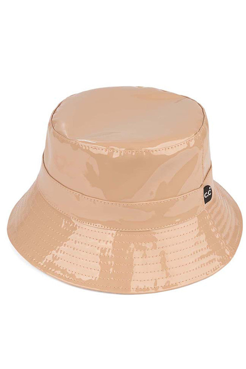 Nude C.C Brand Shiny Solid Color Reflective Enamel Detailed Rain Bucket Hat; this rain hat is snug on the head and works well to keep rain off the head, out of eyes, and also the back of the neck. Wear it to lend a modern liveliness above a raincoat on trans-seasonal days in the city. Perfect Gift for fashion-forward friend