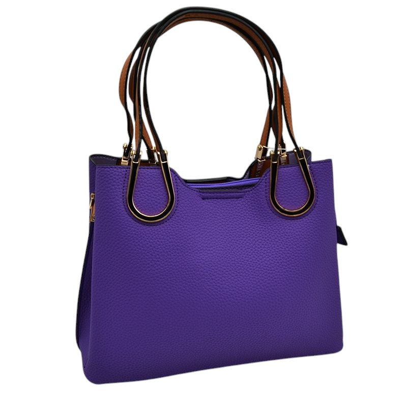 Violet Textured Faux Leather Horseshoe Handle Women's Tote Bag, featuring an eye-catching textured faux leather exterior and a horseshoe-shaped handle. The bag has a spacious interior, perfect for days when you need to carry a lot of items. Its structure and design ensure that your items will stay secure even on the go.