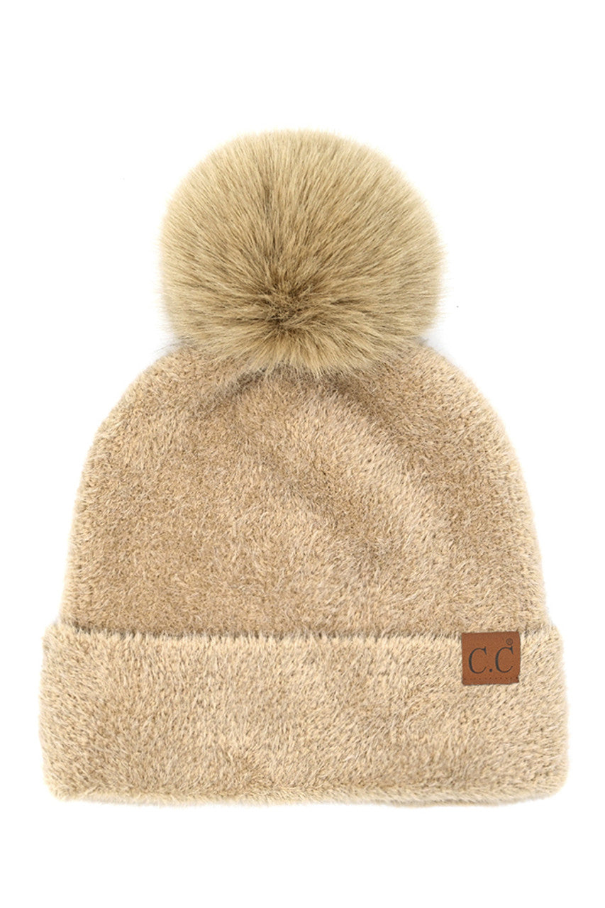 Beige C.C Plush Terry Chenille Pom Beanie Winter Hat combines superior thermal protection with refined style. Constructed from premium terry chenille fabric, this hat delivers exceptional insulation while maintaining breathability. The distinctive pom accent adds visual interest without compromising functionality. Designed with precise dimensions to ensure optimal coverage of ears and forehead, this cold-weather essential maintains its structural integrity throughout extended wear.