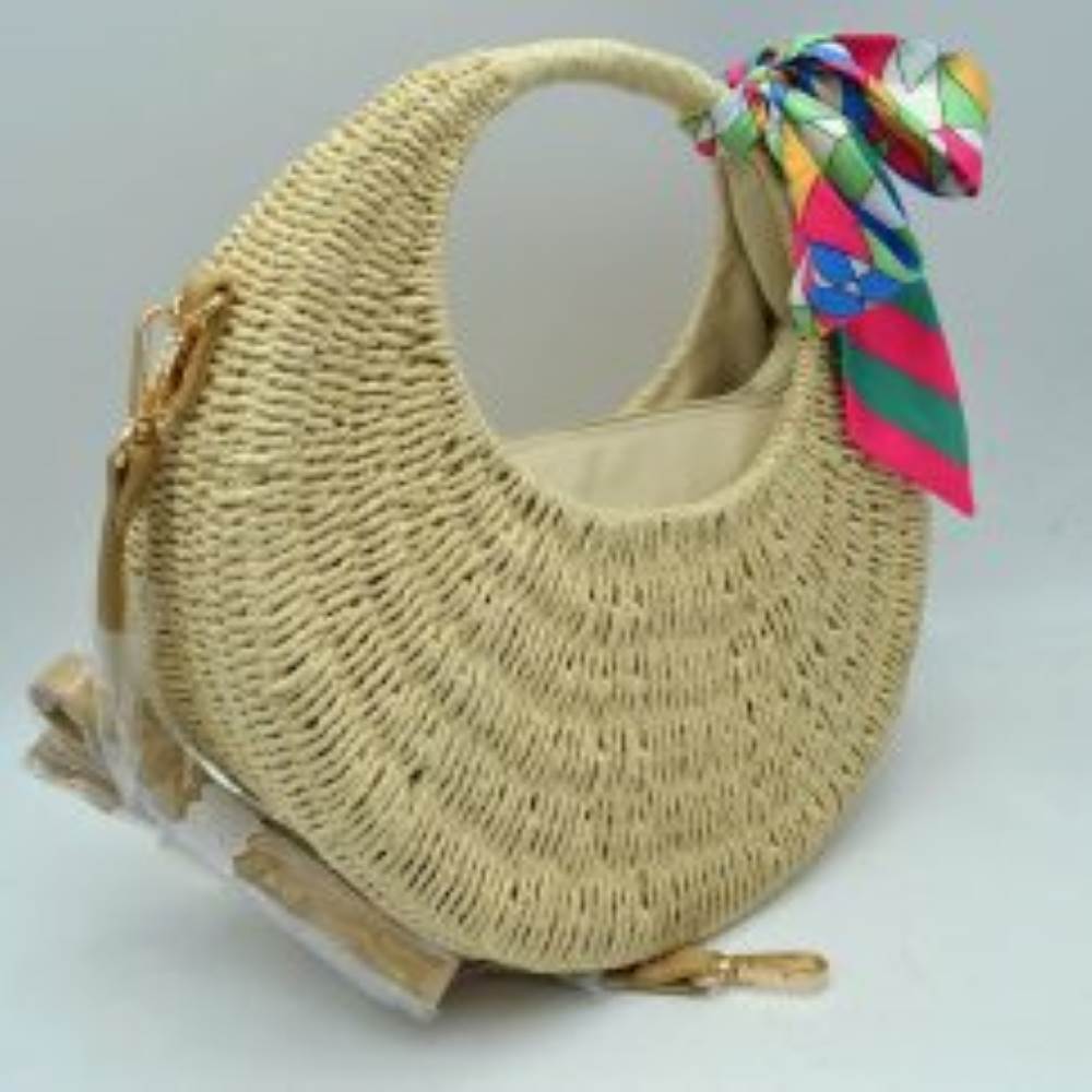 Beige This everyday handbag features a distinct crescent-shaped silhouette with a textured, tightly woven pattern across its body. It includes an integrated curved top handle along with a removable, adjustable shoulder strap attached via metallic clasps on the side. A colorful, geometrically patterned scarf is tied in a bow around the handle base