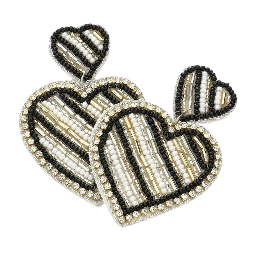 Black Felt Back Beaded Double Heart Link Dangle Earrings are a charming addition to any jewelry collection. The intricate beaded design adds elegance, while the felt backing ensures comfort throughout the day. Perfect for adding a touch of romance to any outfit. Crafted with quality materials for durability and style.
