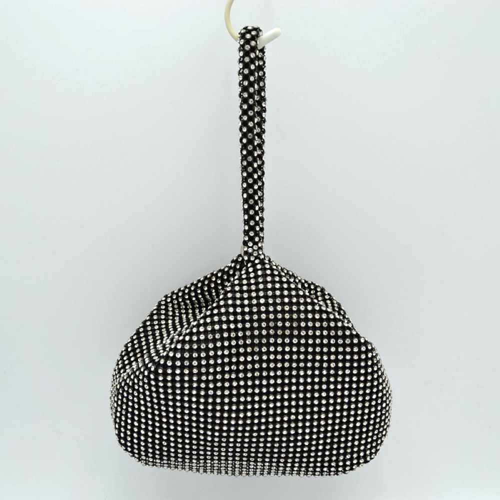 Black Make a bold yet elegant statement with the shimmering evening pouch. Perfect for nights out, formal dinners, or special events, this unique wristlet infuses any outfit with instant texture and subtle sparkle.