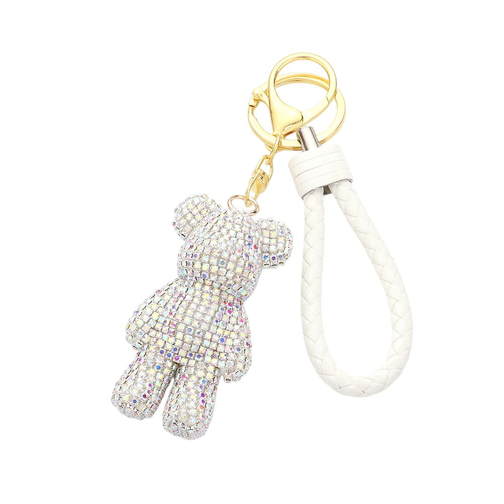 White Bling Bear Figure Faux Leather Strap Bag Charm adds a touch of playful luxury to any handbag. The sparkling bear figure is adorned with shiny crystals, while the faux leather strap offers durability and style. Enhance your accessories collection with this charming bag charm.