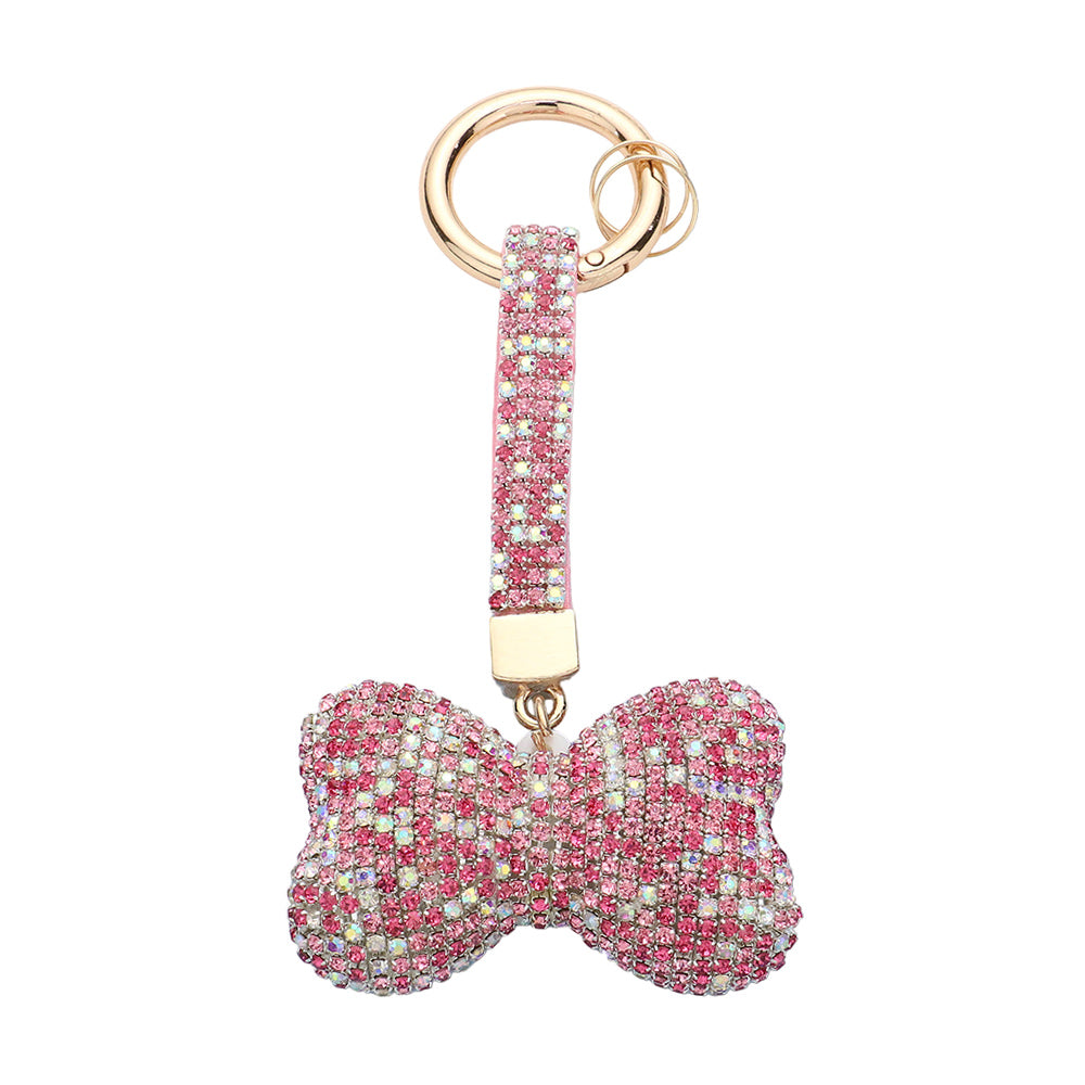 Multi Pink Bling Bow Keychain is a stylish and functional accessory that adds a touch of elegance to your everyday routine. With its eye-catching design and sturdy construction, this keychain is the perfect combination of fashion and convenience. Keep your keys organized and make a statement with the Bling Bow Keychain.