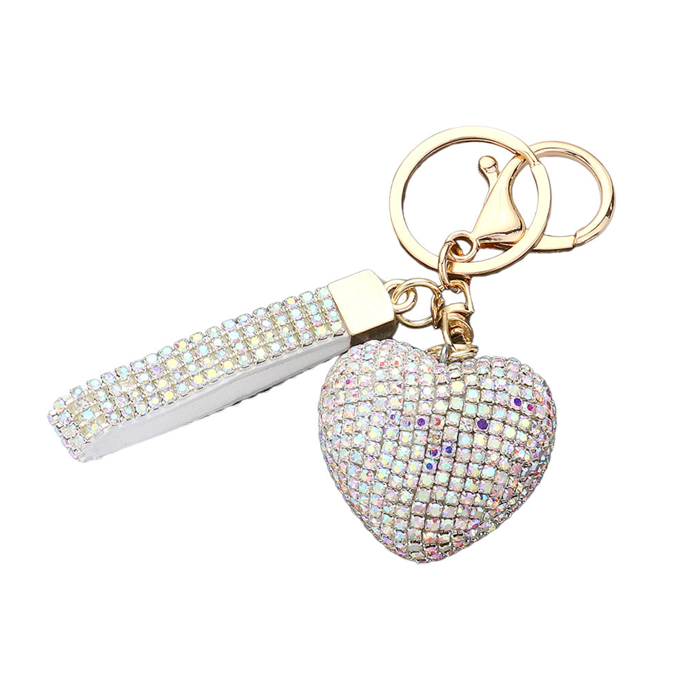 Bling Heart Keychain is a stylish accessory that adds a touch of elegance to your everyday look. Made with high-quality materials, it features a sparkling heart design that will catch everyone's eye. Perfect for keeping your keys organized and adding some glam to your day.