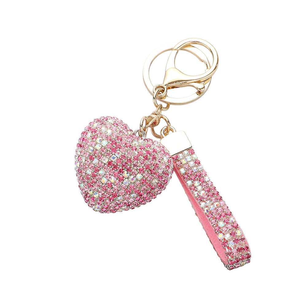 Bling Heart Keychain is a stylish accessory that adds a touch of elegance to your everyday look. Made with high-quality materials, it features a sparkling heart design that will catch everyone's eye. Perfect for keeping your keys organized and adding some glam to your day.