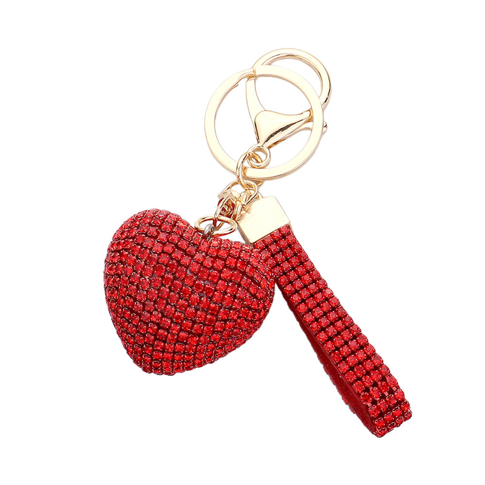 Bling Heart Keychain is a stylish accessory that adds a touch of elegance to your everyday look. Made with high-quality materials, it features a sparkling heart design that will catch everyone's eye. Perfect for keeping your keys organized and adding some glam to your day.