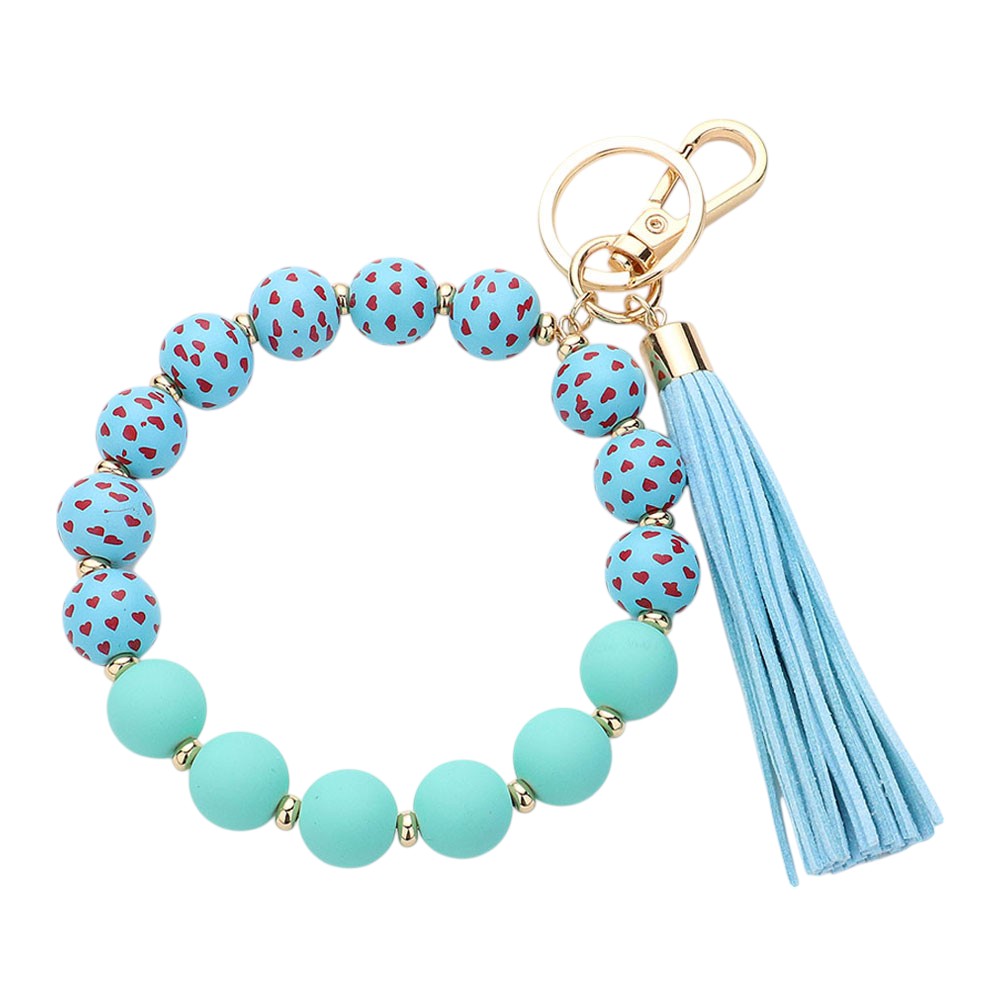 Blue Heart Patterned Beaded Tassel Keychain Bracelet is a charming addition to your accessory collection. Handcrafted with intricate beadwork and a delicate heart pattern, it can be used as a keychain or stylish bracelet. Elevate your style while keeping your keys or wrist secure with this beautiful piece.
