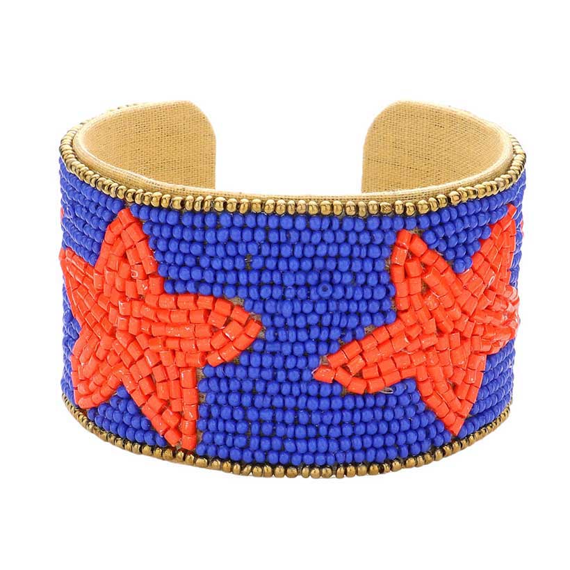 Blue Orange This Game Day Beaded Star Accented Cuff Bracelet adds a stylish touch to any ensemble. The beaded star accents on the cuff give it a unique, eye-catching design, perfect for game day or any day. Wear it to show your support for your favorite team - you're sure to stand out from the crowd.