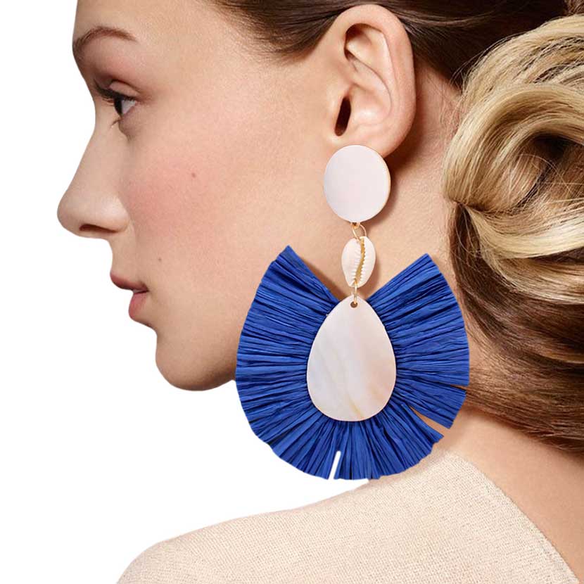 Blue Puka Shell Mother of Pearl Teardrop Raffia Trimmed Earrings, adorn yourself with these teardrop raffia trimmed earrings! puka shell mother-of-pearl teardrop earrings go perfectly with a t-shirt, summer dress or work clothes, beach party, and many more.