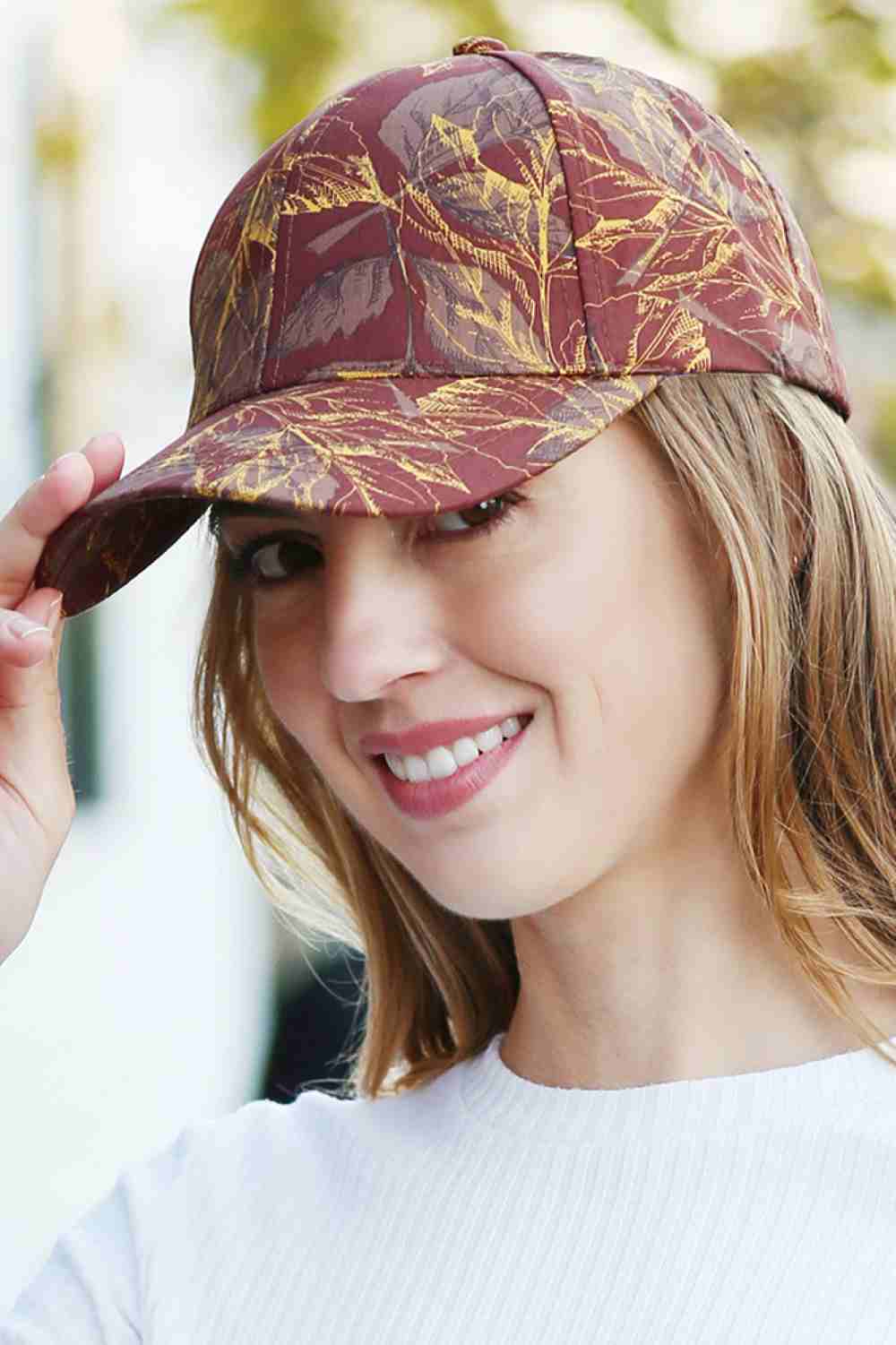 Brown The Leaves Print Cotton Baseball Cap is crafted from soft, breathable cotton and features an eye-catching leaf print for a fresh, natural look. Designed with an adjustable back strap, it provides a comfortable fit and effortless everyday style.