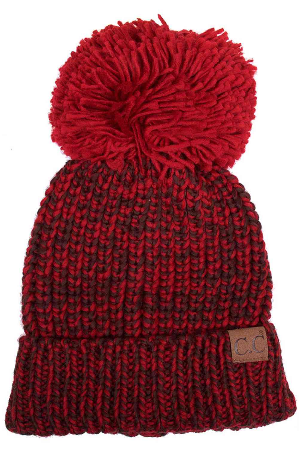 Burgundy Elevate your winter wardrobe with the C.C Dual Color Knit Beanie featuring a charming pom-pom accent. Crafted from 100% soft acrylic, this two-tone design combines comfort with contemporary style. The versatile knit construction provides warmth without excess bulk, making it ideal for layering under hoods or wearing solo. The playful pom-pom adds a touch of personality to any cold-weather look. One size fits most for effortless, all-season wear that transitions seamlessly from casual outings to out