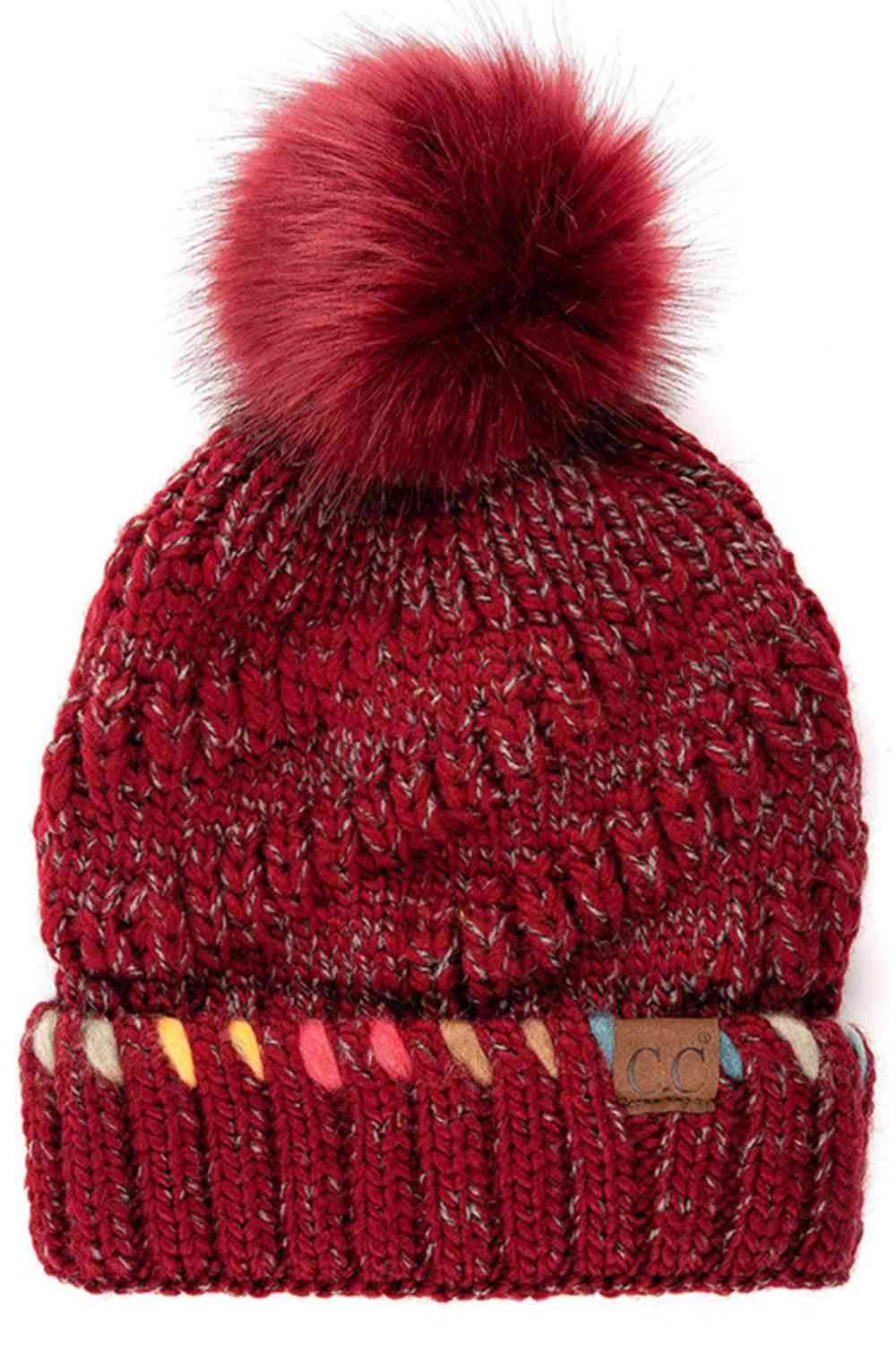 Burgundy C.C Pom Beanie with ombre dyed accent yarn in the cuff delivers cozy warmth with eye-catching style. This chunky knit beanie features a soft pom-pom on top and rich ombre coloring that transitions beautifully throughout the cuff. Made from 100% acrylic, it's lightweight yet insulating—perfect for layering or wearing solo during chilly days.