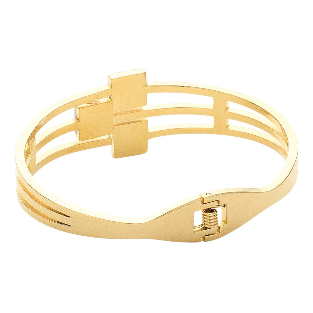 Clear Gold Stainless Steel Triple Square Stone Pointed Hinged Bangle Bracelet is a stylish and durable accessory. Made with high-quality stainless steel and featuring a hinged design, it is perfect for everyday wear. The triple square stone detailing adds a touch of elegance and sophistication to any outfit.