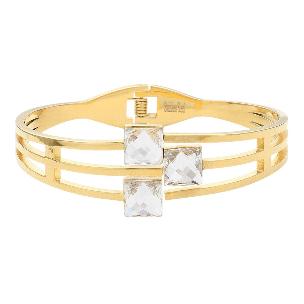 Clear Gold Stainless Steel Triple Square Stone Pointed Hinged Bangle Bracelet is a stylish and durable accessory. Made with high-quality stainless steel and featuring a hinged design, it is perfect for everyday wear. The triple square stone detailing adds a touch of elegance and sophistication to any outfit.