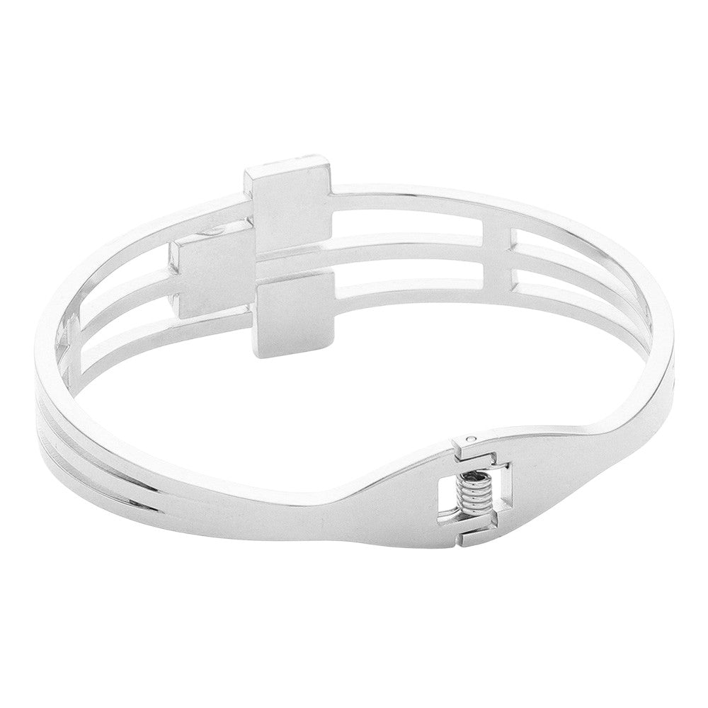 Clear Silver Stainless Steel Triple Square Stone Pointed Hinged Bangle Bracelet is a stylish and durable accessory. Made with high-quality stainless steel and featuring a hinged design, it is perfect for everyday wear. The triple square stone detailing adds a touch of elegance and sophistication to any outfit.