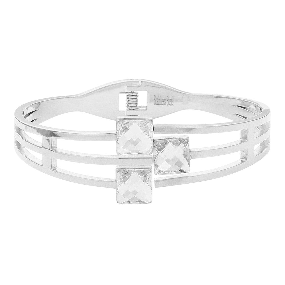 Clear Silver Stainless Steel Triple Square Stone Pointed Hinged Bangle Bracelet is a stylish and durable accessory. Made with high-quality stainless steel and featuring a hinged design, it is perfect for everyday wear. The triple square stone detailing adds a touch of elegance and sophistication to any outfit