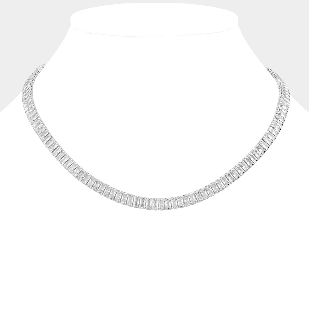 Clear Silver Stainless Steel Emerald Cut CZ Stone Tennis Chain Necklace exudes elegance and sophistication. Made with durable stainless steel and featuring sparkling emerald cut CZ stones, it's the perfect accessory to elevate any outfit. With its classic tennis chain design and stunning stones, this necklace is a must-have for any jewelry collection.