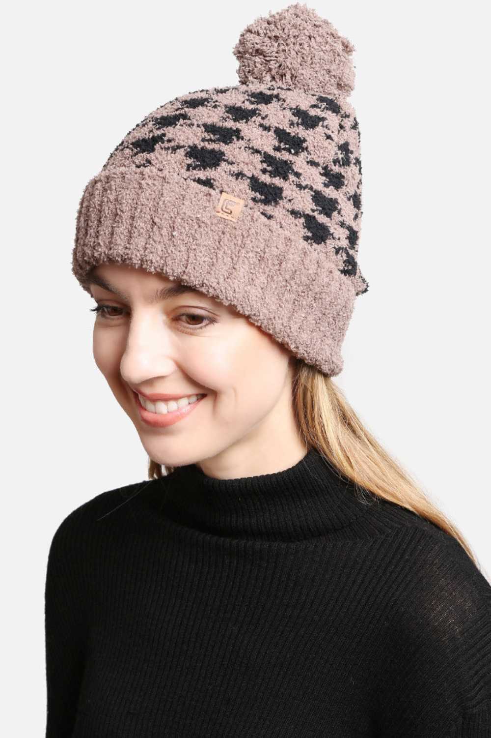 Coffee Houndstooth Pom Pom Beanie with Lining features a classic houndstooth pattern with a cozy, lined interior and a fluffy pom for extra warmth. Designed with a soft stretch fit, it delivers comfortable insulation while adding timeless style to your cold-weather outfits.