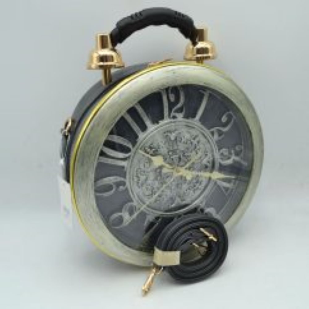 Dark This unique novelty handbag features a structured round silhouette designed to look like a vintage twin-bell alarm clock, making it an exceptional statement piece. The prominent front panel showcases a large clock face detailed with oversized numbers and ornate gold-tone hands, beautifully enclosed within a wood-grain textured circular frame and a clear protective cover. Mimicking a classic alarm clock