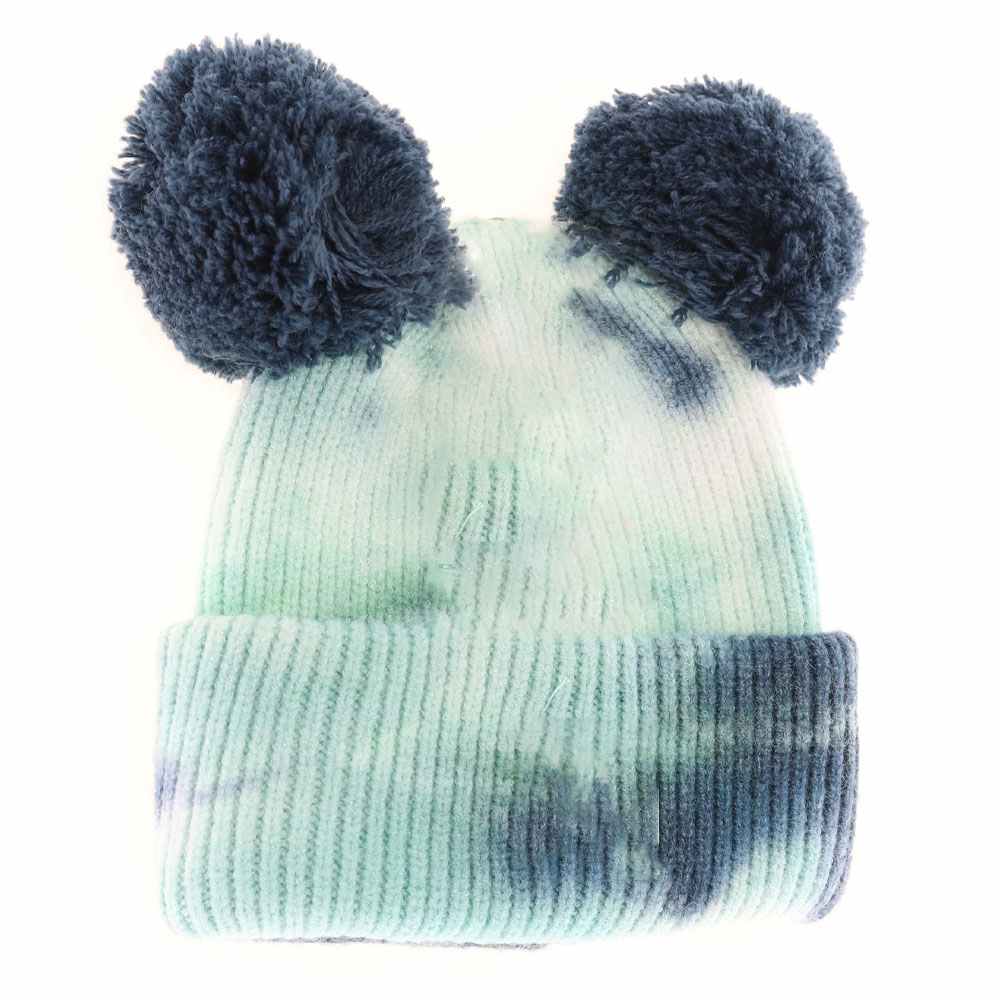 DeepTeal-SeaGreen- BABY Tie Dye Double Fur Pom C.C Beanie combines cozy warmth with playful style, featuring a soft double-layered knit for extra insulation. Its vibrant tie-dye pattern adds a trendy, youthful touch, while the plush double fur pom offers a charming accent. Designed for delicate baby heads, this beanie ensures comfortable wear and keeps little ones snug during cooler days. Ideal for everyday outings or as a stylish statement accessory in any baby wardrobe.