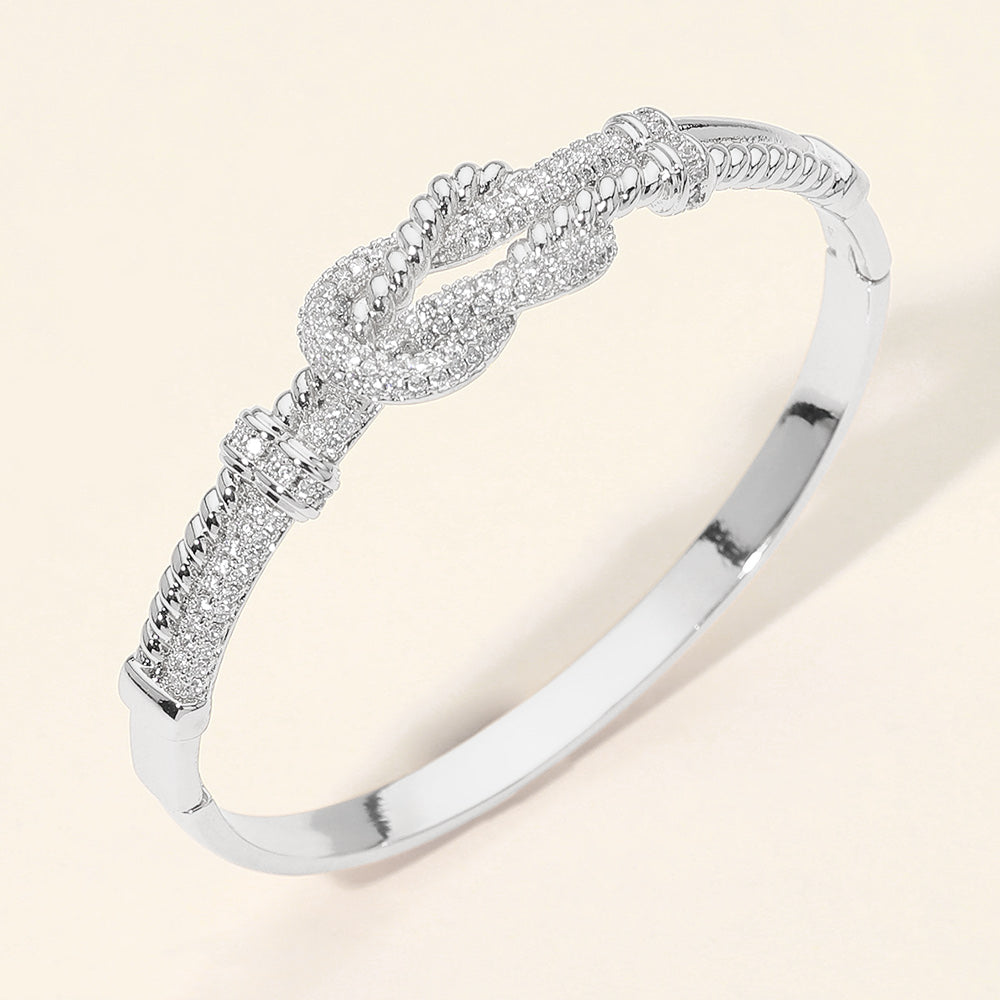 Madeline Love Rhodium CZ Pave Infinity Knot Accent Hinged Bangle Bracelet