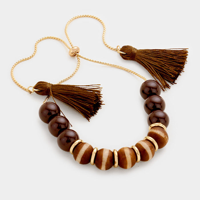 Madeline Love Brown, Gold Beaded Double Tassel Adjustable Pull Tie Bracelet - Bracelets