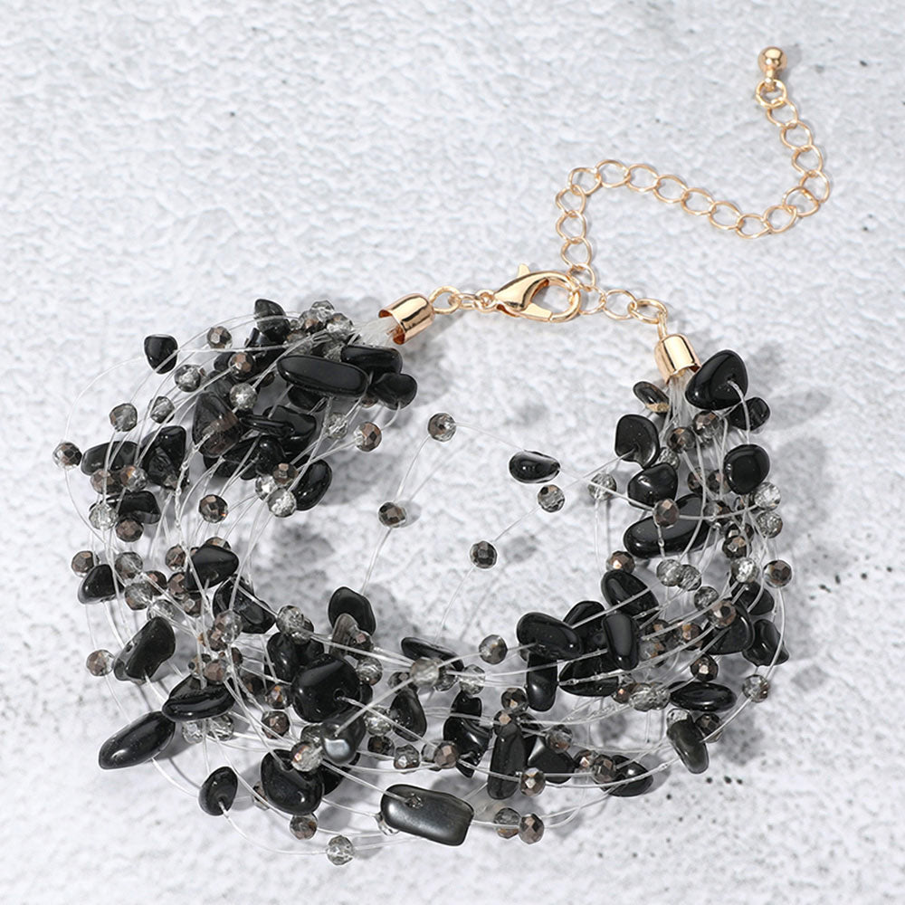 Madeline Love Black, Gold Pebble Faceted Beads Transparent Thread Multi Layered Strand Bracelet