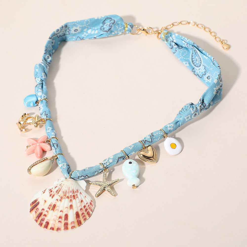 Madeline Love Light Blue Seashell Starfish Anchor Heart Charm Station Fabric Statement Necklace - Necklaces