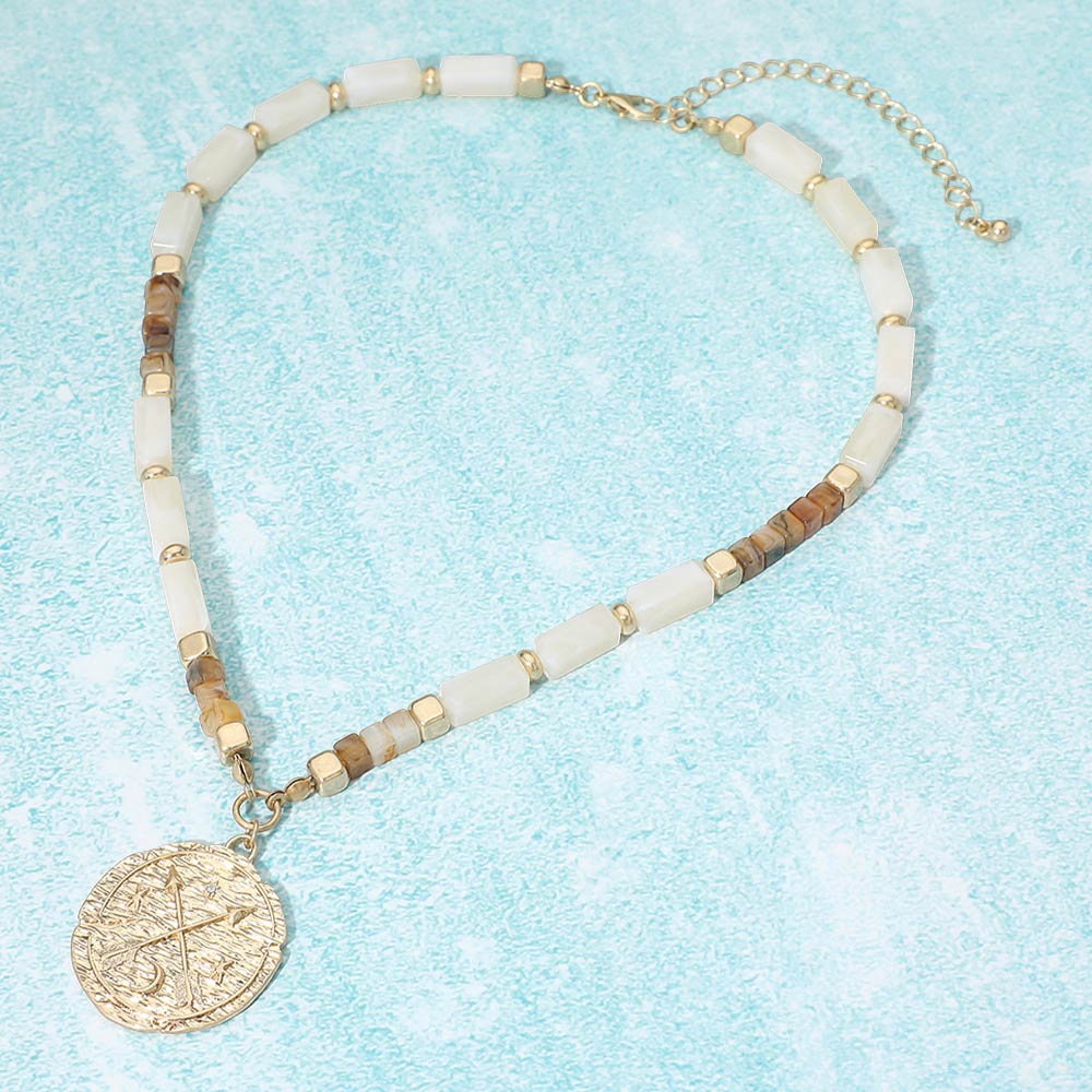 Madeline Love Ivory, Worn Gold Textured Zodiac Coin Pendant Beaded Necklace - Necklaces