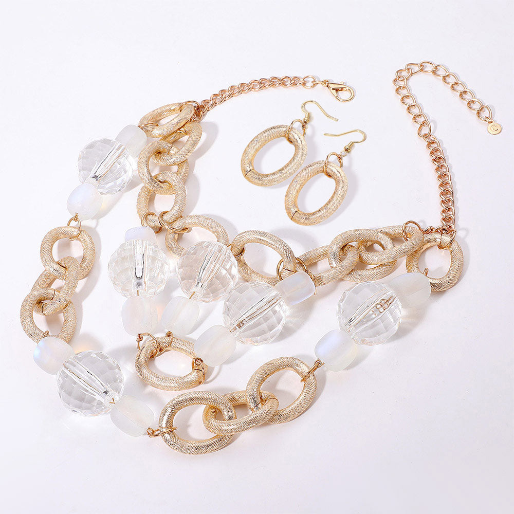 Madeline Love Clear, Gold Chunky Acrylic Ball Textured Metal Ring Abstract Chandelier Statement Necklace - Necklaces