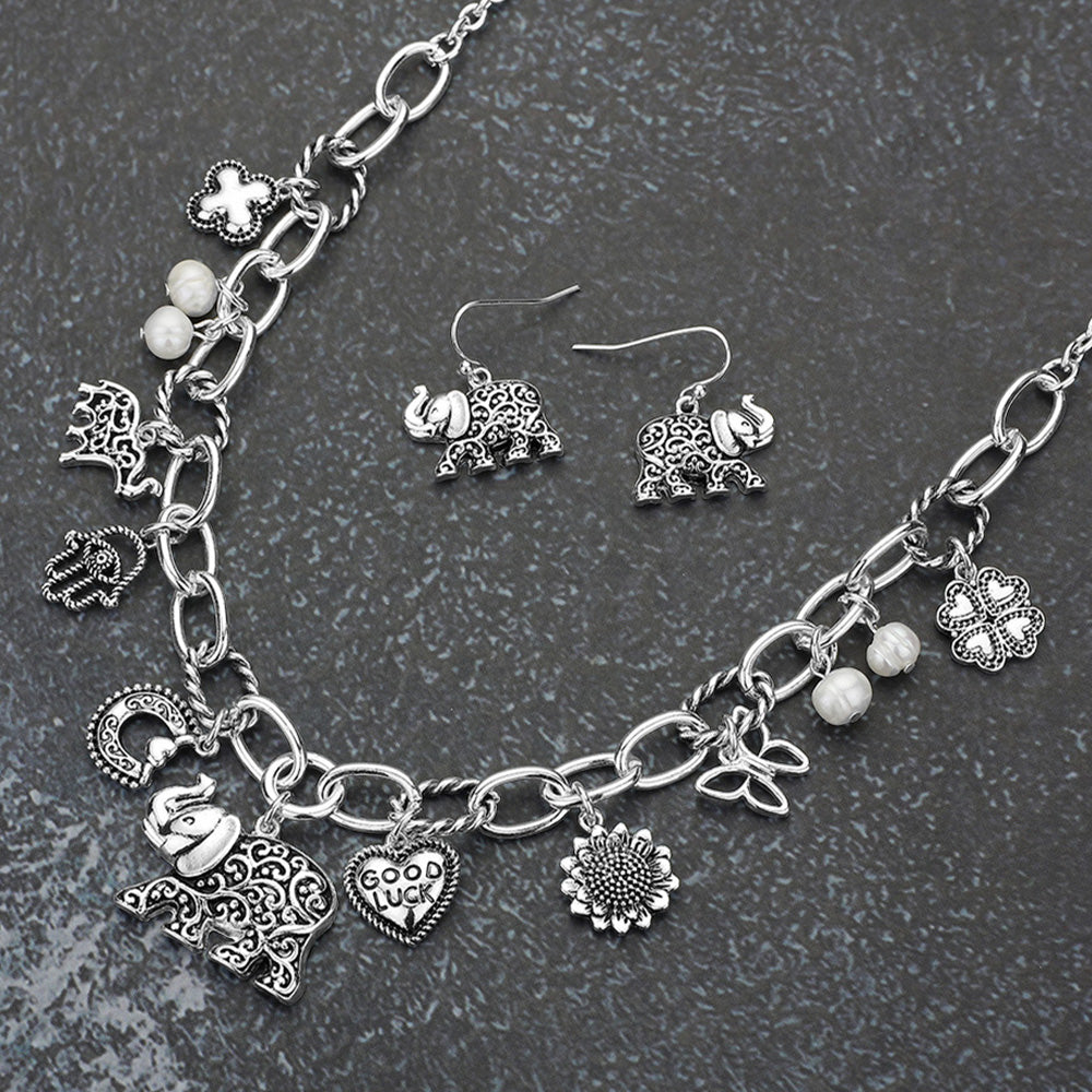Madeline Love Antique Silver Antique Metal Elephant Hamsa Hand Clover Quatrefoil Butterfly Good Luck Heart Pearl Charm Station Necklace - Necklaces