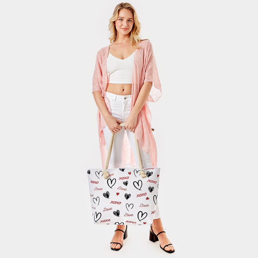 XOXO Love Beach Bag is the perfect accessory for a day at the beach. Crafted with durable materials, it can hold all your beach essentials with ease. Featuring a spacious design and a stylish XOXO pattern, this bag ensures you're ready for a fun day in the sun. Enjoy a carefree beach day with this must-have accessory.