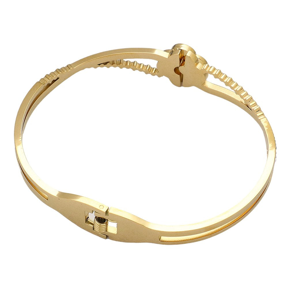 Gold Mother Of Pearl Stone Paved Stainless Steel Hinged Bangle Bracelet adds a touch of elegance to any outfit. The shimmering mother-of-pearl stones are intricately paved on a durable stainless steel hinged bangle, providing both style and durability. Elevate your jewelry collection with this stunning piece.