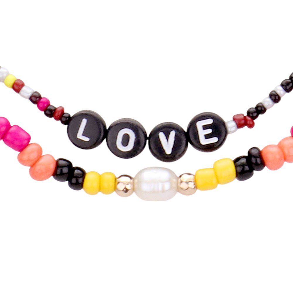 Gold Multi Color Bead Statement Love Layered Necklace adds a pop of color to any outfit! The multi-layered design and vibrant beads create a unique statement piece that is sure to catch attention. Elevate your style with this eye-catching necklace.