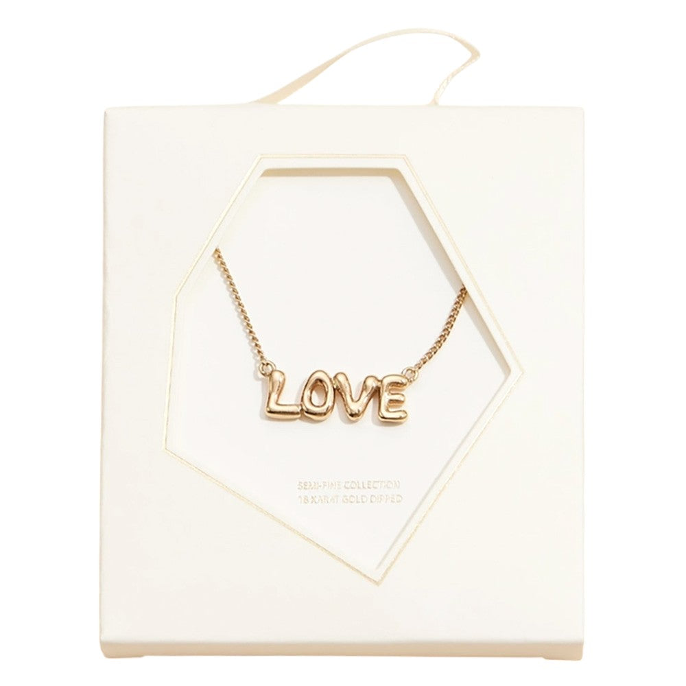 Gold Semi Fine Collection presents a stunning 18K gold dipped brass metal necklace featuring a LOVE message pendant. This necklace adds a touch of sophistication and elegance to any outfit, making it a perfect addition to any jewelry collection. Show your love with this timeless piece.
