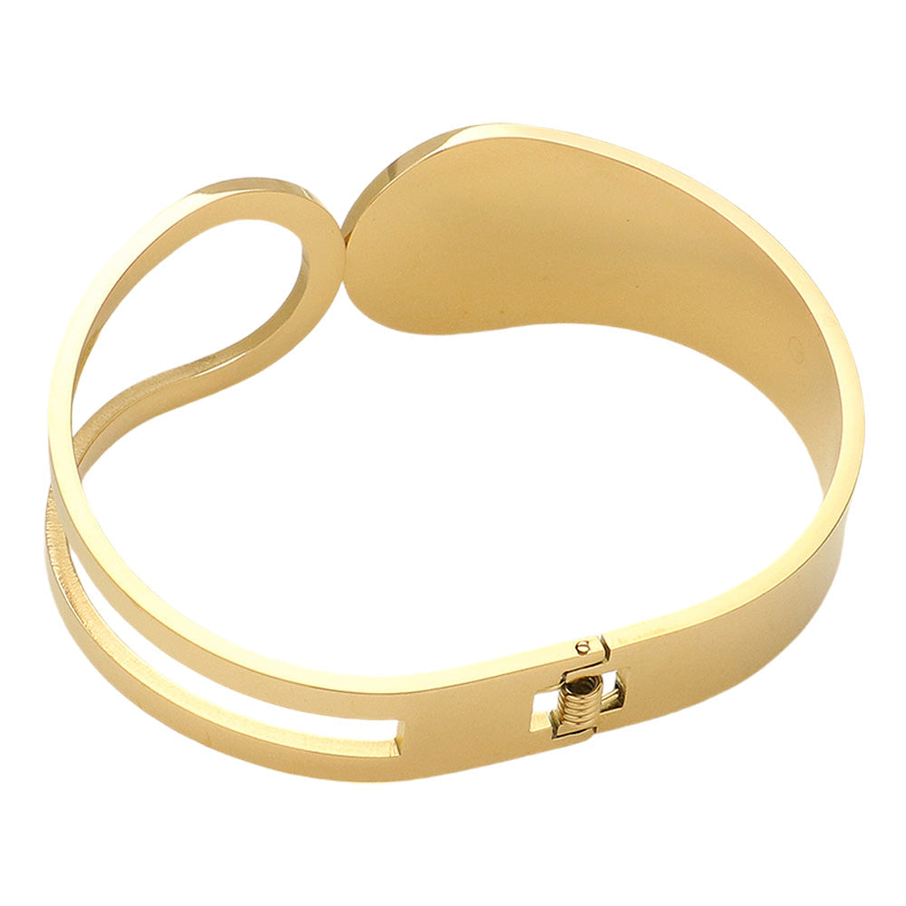 Gold Stainless Steel Abstract Hinged Bangle Bracelet features a beautiful and modern abstract design. Crafted with high-quality stainless steel, it is durable and resistant to corrosion. The hinged closure provides a secure and comfortable fit. Elevate your style with this unique and timeless bracelet.