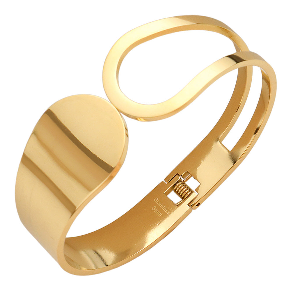 Gold Stainless Steel Abstract Hinged Bangle Bracelet features a beautiful and modern abstract design. Crafted with high-quality stainless steel, it is durable and resistant to corrosion. The hinged closure provides a secure and comfortable fit. Elevate your style with this unique and timeless bracelet.