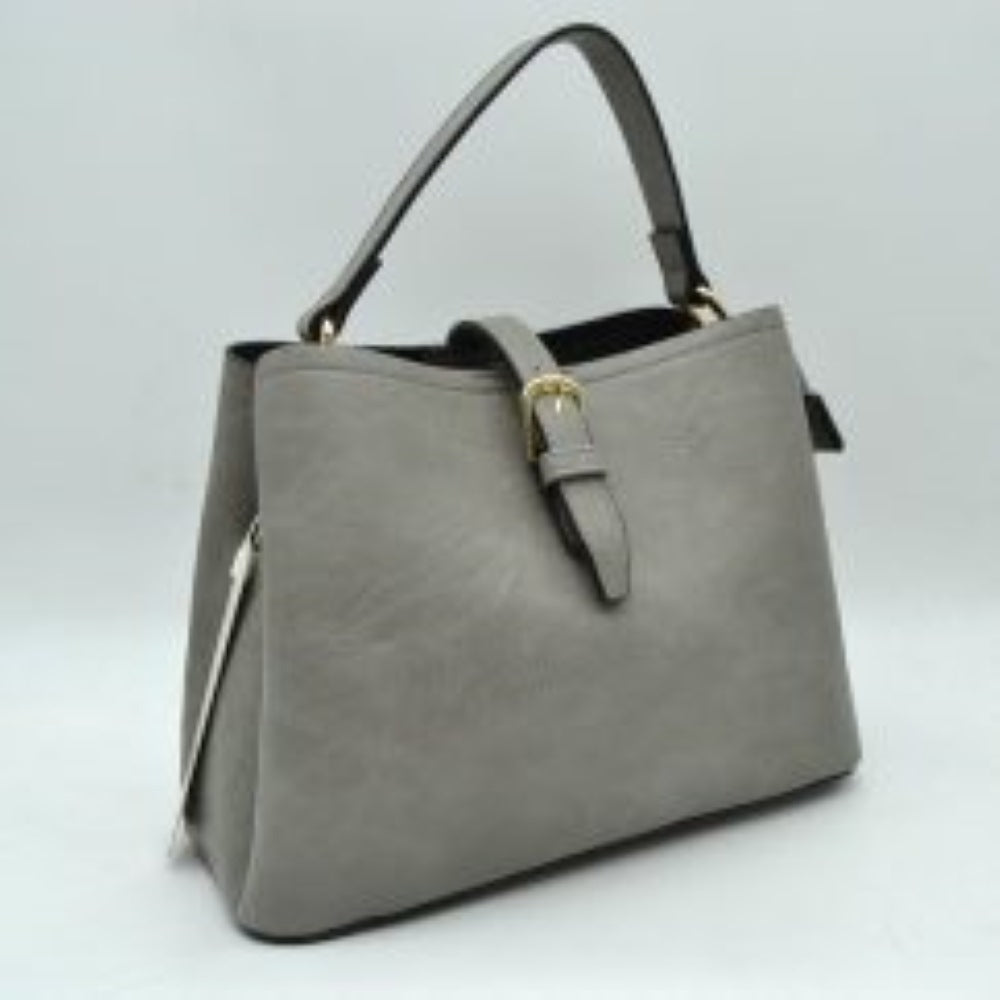 Gray Designed for stylish everyday use, this versatile bag features a textured finish with a central decorative buckle strap across the open top. It offers multiple carrying options, including a sturdy top handle and a wide, removable shoulder strap showcasing a detailed geometric woven pattern. Complete w/ secure metal hardware clasps and an adjustable slide buckle on the patterned strap, this spacious bag blends practical storage compartments w/ a modern aesthetic for convenient hands-free styling.