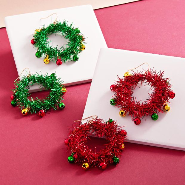 Bring festive flair to your outfit with these tinsel wreath earrings, decorated with playful jingle bell charms. Perfect for holiday events, seasonal parties, or adding cheer to everyday looks, these lightweight earrings offer a bold and joyful statement.
