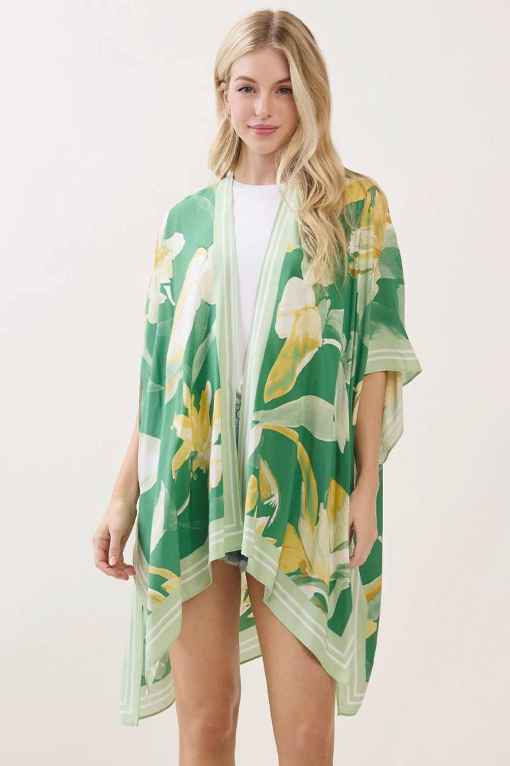 Green Effortless elegance meets bohemian charm with this stunning floral print kimono cover up. Crafted from 100% viscose, the fabric drapes beautifully while offering a soft, breathable feel perfect for layering over swimwear or casual outfits. The generous 40" x 60" dimensions provide comfortable coverage and movement. Whether you're heading to the beach, poolside, or embracing a relaxed weekend look, this versatile piece brings an artistic, free-spirited vibe to any wardrobe.