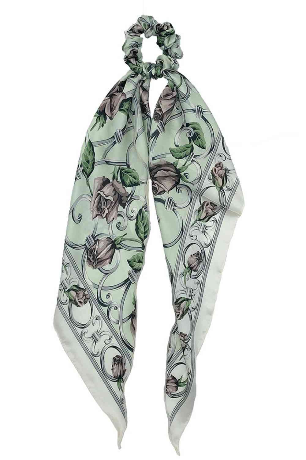 Green Elevate your hair accessory game with this charming floral print scarf ponytail holder. Crafted from 100% polyester, it combines style with practicality, keeping your hair secured while adding a pop of color to your look. The versatile one-size design works for all hair types and occasions from casual days to special events. Perfect for anyone who loves effortless elegance and floral aesthetics.