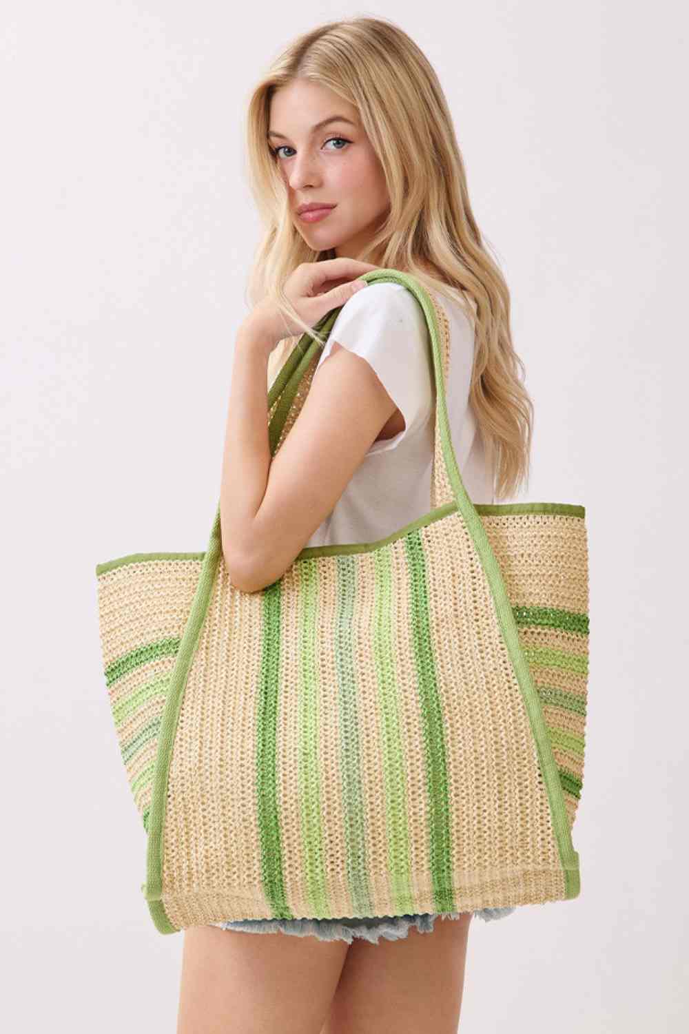 Green Carry your essentials in style with this vibrant Multi Color Stripe Pattern Natural Straw Tote Bag. Crafted from 100% paper straw, this spacious bag measures 20" x 14" x 5.5" and features a convenient magnetic snap closure to keep your items secure. The inner pocket provides extra organization for smaller belongings. Perfect for beach trips, farmers markets, or everyday use, this durable tote combines natural materials with eye-catching color stripes for a fresh, summery look.