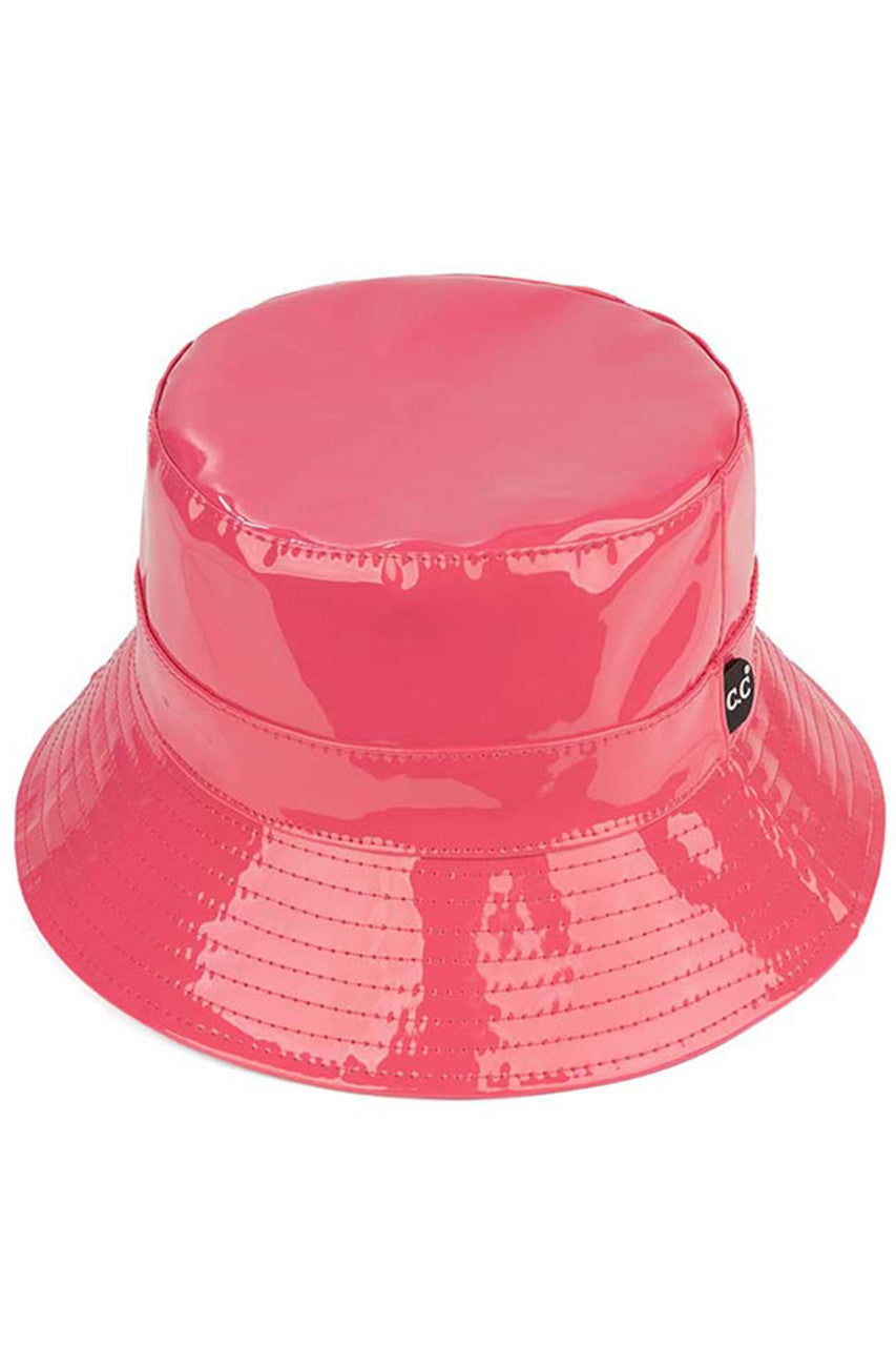 Hot PInk C.C Brand Shiny Solid Color Reflective Enamel Detailed Rain Bucket Hat; this rain hat is snug on the head and works well to keep rain off the head, out of eyes, and also the back of the neck. Wear it to lend a modern liveliness above a raincoat on trans-seasonal days in the city. Perfect Gift for fashion-forward friend