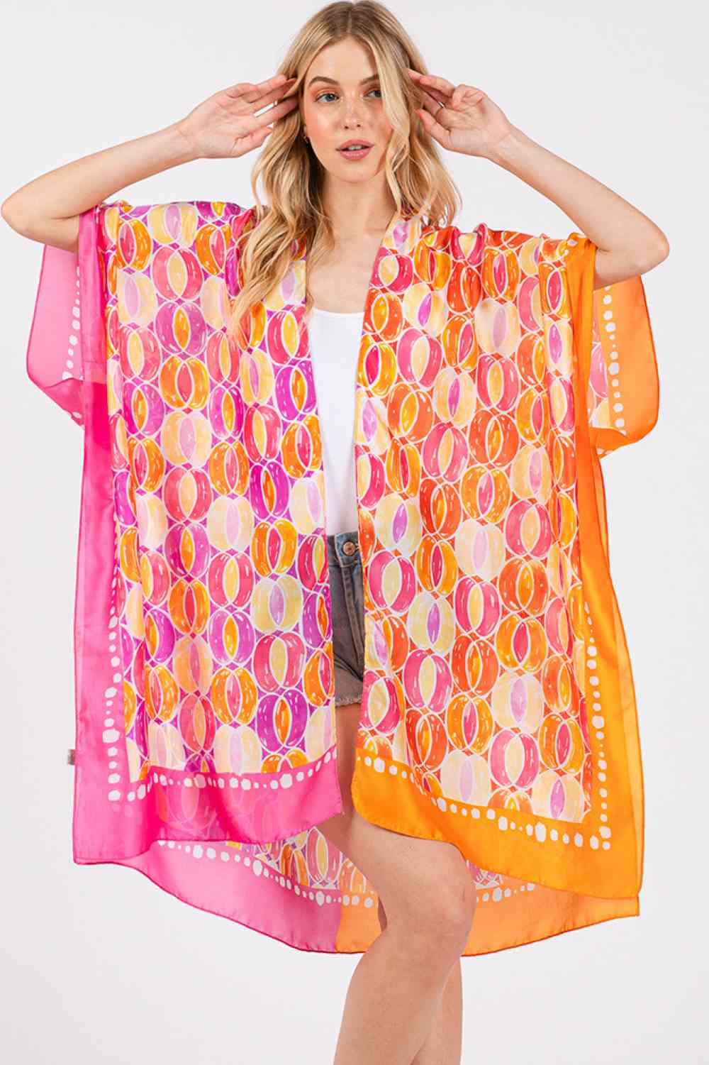 Hot Pink Effortless elegance meets summer style with this Two Tones Trim Abstract Pattern Kimono. Crafted from 100% polyester with a luxuriously silky feel, this lightweight cover-up drapes beautifully over any outfit. The striking abstract pattern and contrasting two-tone trim add visual interest and versatility for beach days, poolside lounging, or casual outings. Generously sized at 35" x 36", it offers comfortable coverage and movement. Perfect for layering during warmer months.