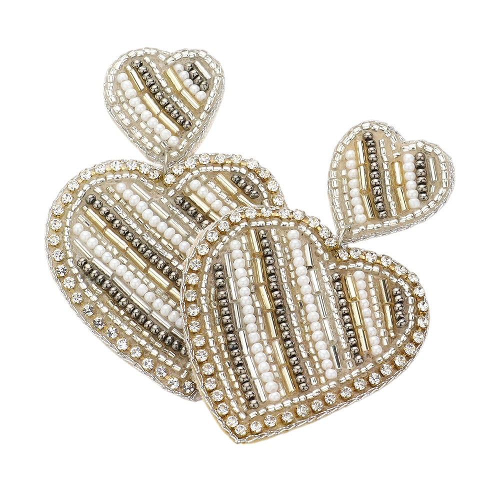 Ivory Felt Back Beaded Double Heart Link Dangle Earrings are a charming addition to any jewelry collection. The intricate beaded design adds elegance, while the felt backing ensures comfort throughout the day. Perfect for adding a touch of romance to any outfit. Crafted with quality materials for durability and style.