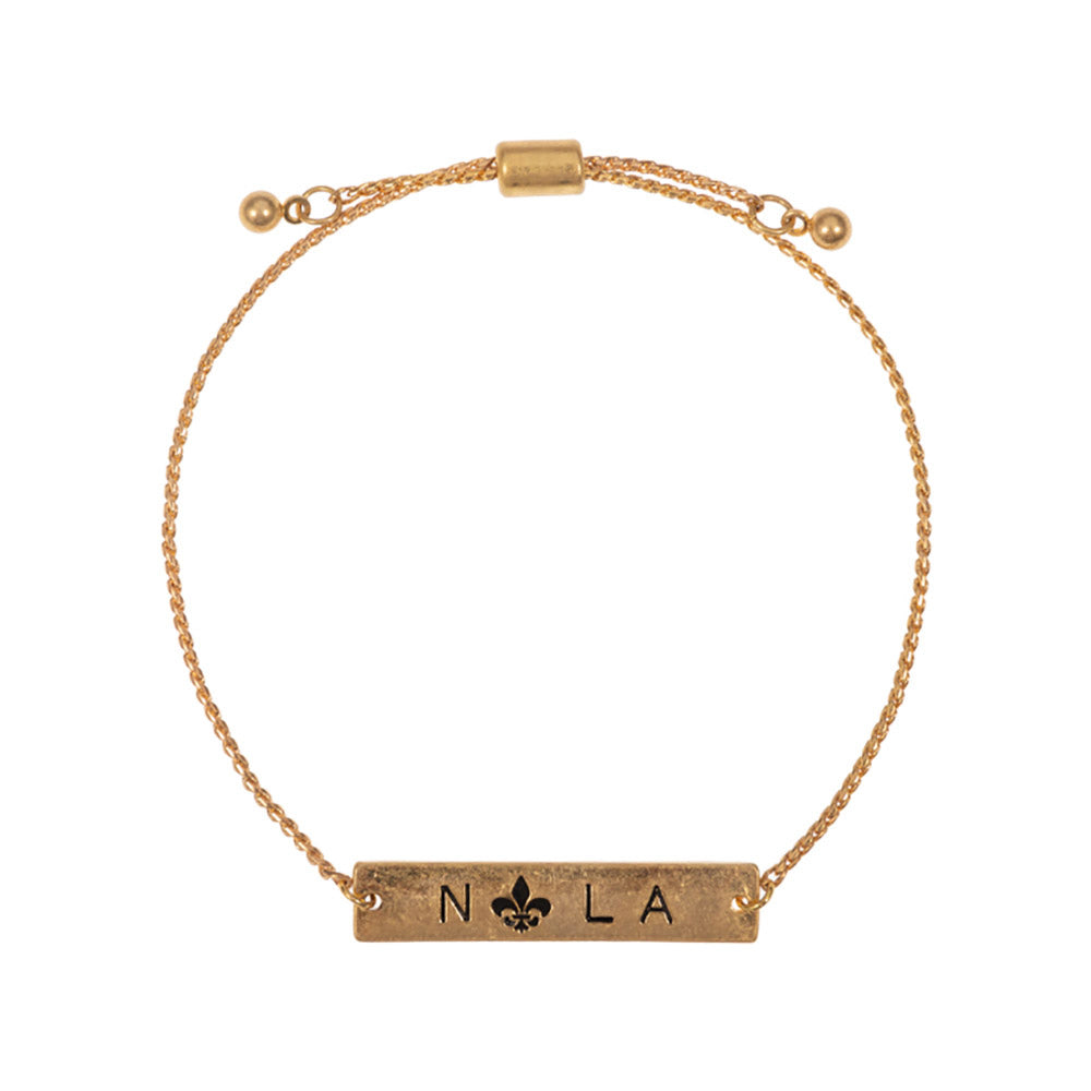 Jet Black Fleur de Lis Pointed Nola Message Pull Tie Cinch Bracelet, adds a sophisticated touch to any outfit. Crafted from an exquisite combination of materials, the bracelet features a Fleur de Lis pointed design with a Nola message pull tie cinch closure that makes it the perfect accessory for any occasion or as a lovely gift.