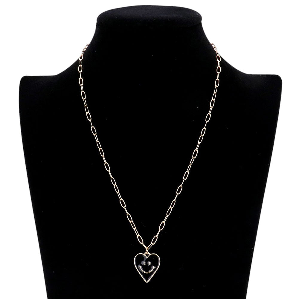 Jet Black Smile Pointed Enamel Heart Pendant Necklace is expertly crafted to showcase its unique design. The pointed enamel heart adds a playful touch to any outfit. Made with high-quality materials, this necklace is durable and will remain a timeless piece in your jewellery collection.