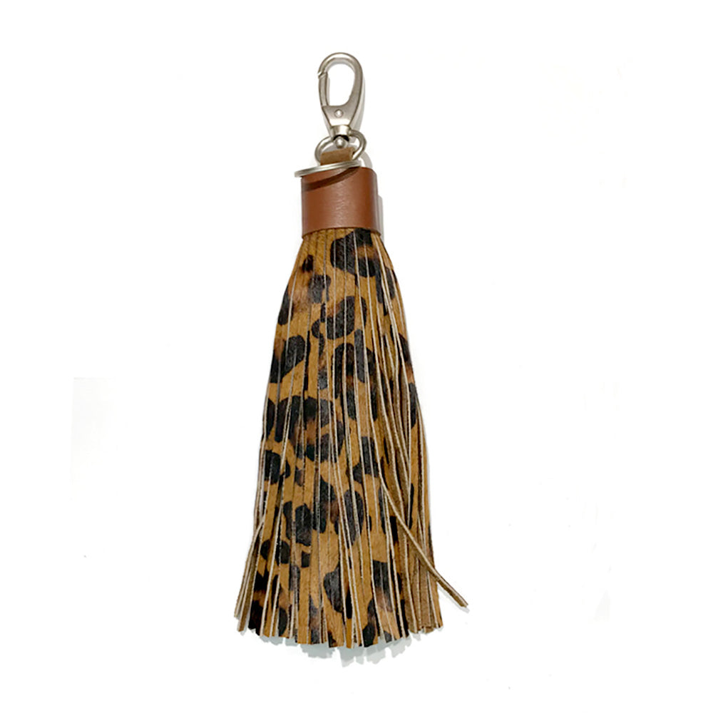 Leopard Patterned Genuine Leather Tassel Bag Charm adds a stylish touch to any bag with its trendy leopard pattern. Made from high-quality leather, it's a durable and chic accessory that enhances the look of your bag. Elevate your style with this must-have bag charm.