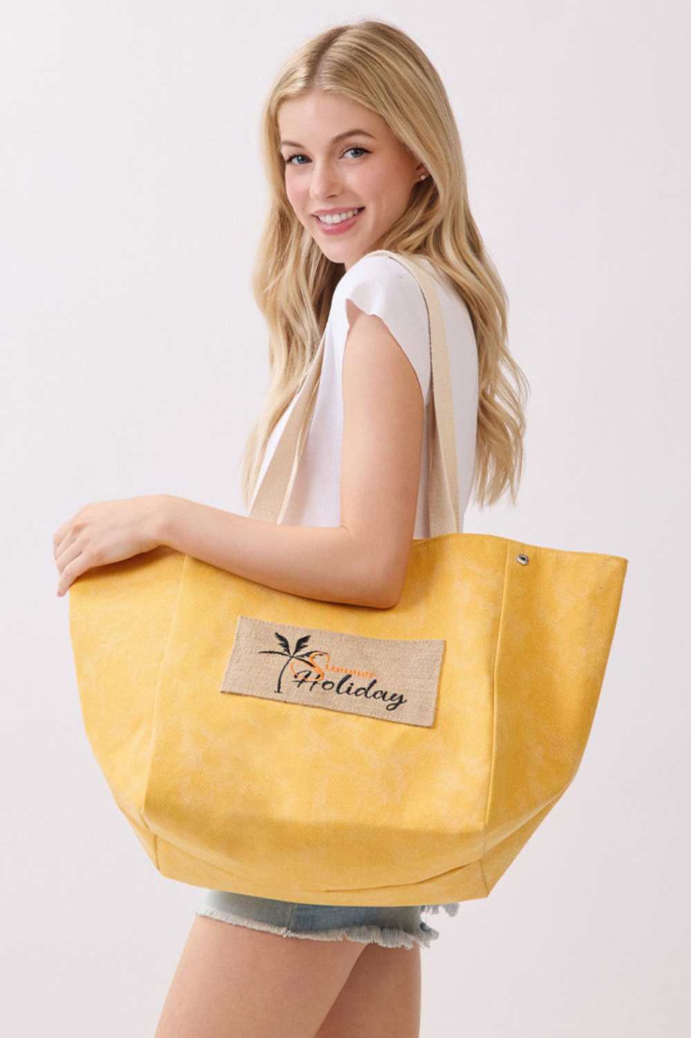 Mustard Carry your summer essentials in style with this versatile shoulder and bucket-style canvas tote. Crafted from a durable blend of 90% polyester and 10% burlap, this spacious bag features a charming SUMMER HOLIDAY letter design that captures the spirit of the season. Measuring 22" x 13" x 9.5", it offers plenty of room for beach days, picnics, or weekend getaways. The magnetic snap closure keeps your belongings secure, while the convenient inner pocket provides organized storage for smaller items. Per